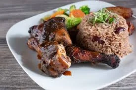 Jamaican jerk chicken with rice and peas