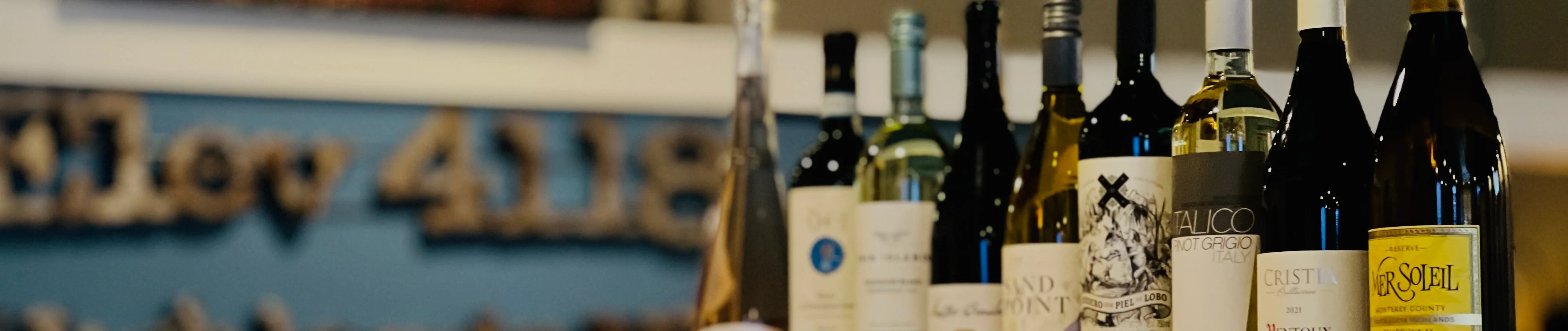 Selection of wines displayed on a restaurant shelf