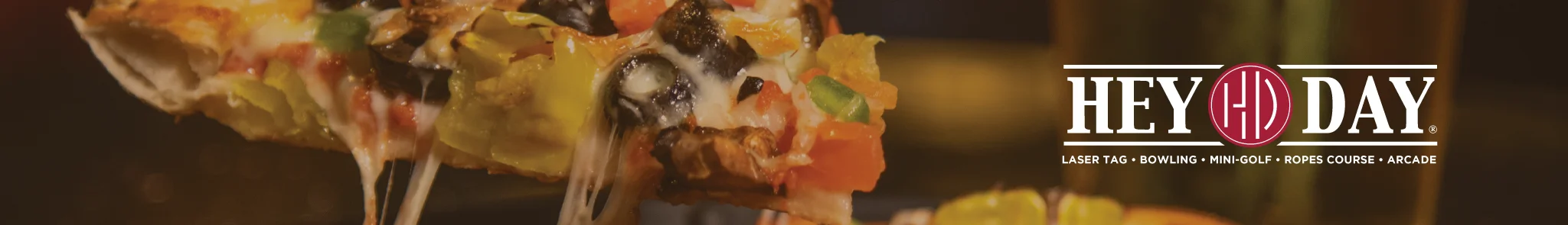 Cheesy pizza slice with colorful toppings