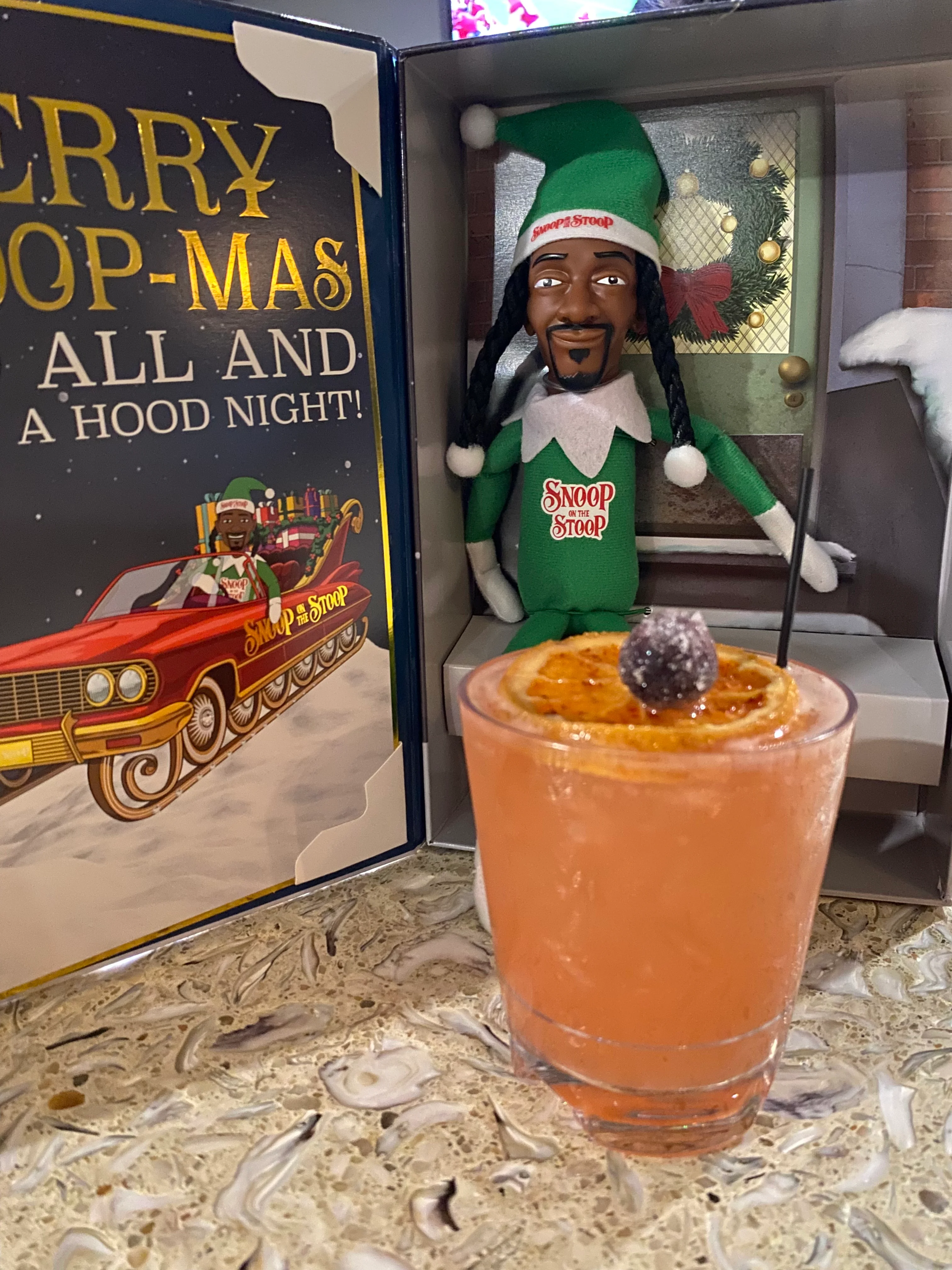 Festive cocktail with Snoop-themed decor