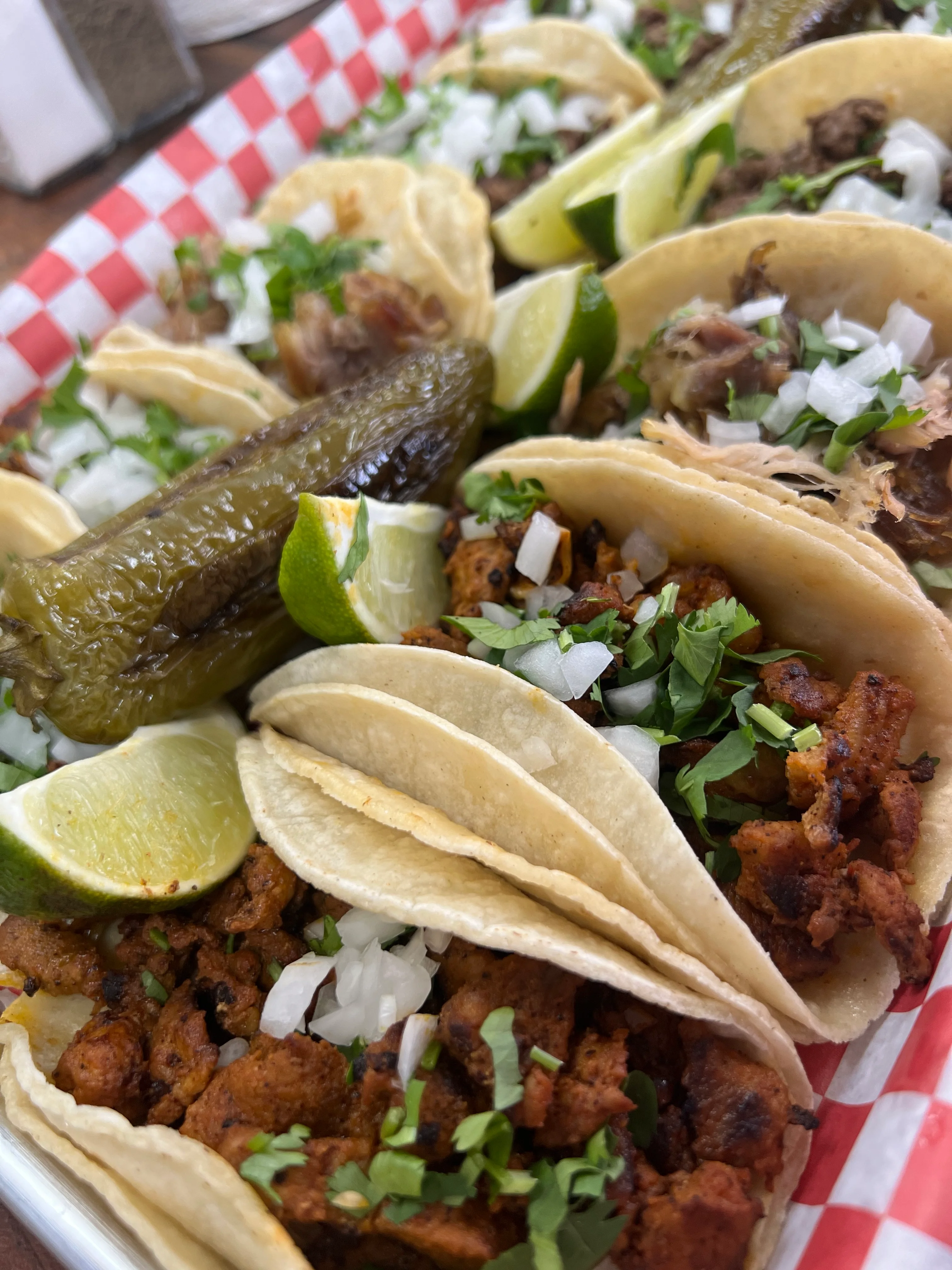 Delicious Mexican street tacos with lime and jalapeño