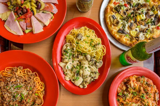 Italian pasta dishes with pizza and antipasto platter