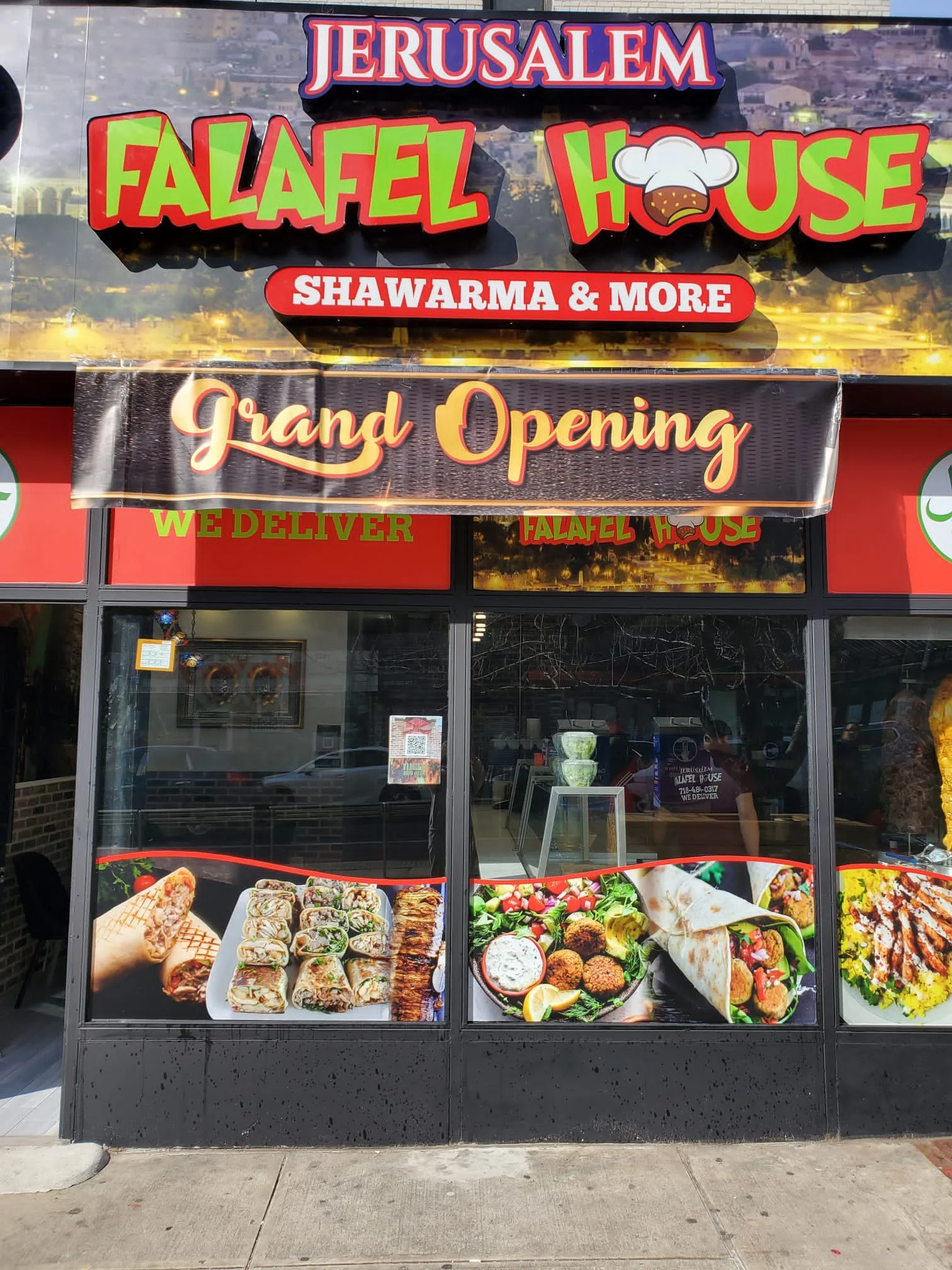 Jerusalem Falafel House storefront with grand opening banner