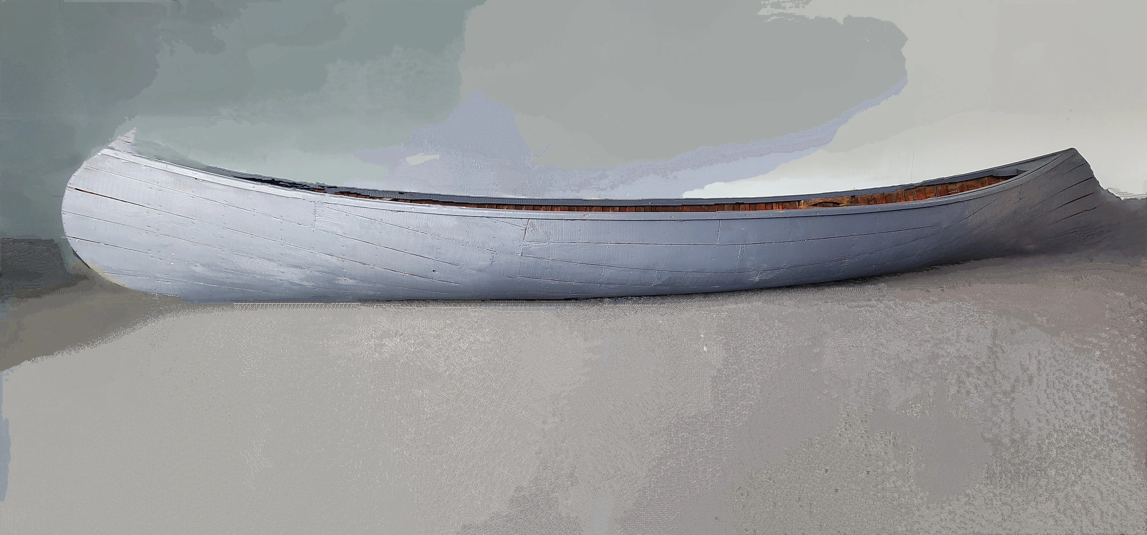 Traditional wooden canoe on a neutral background