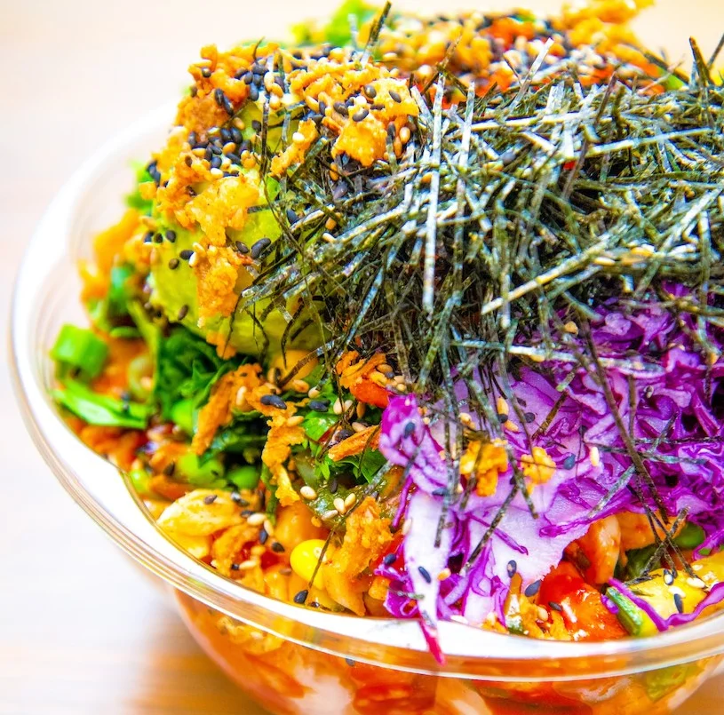 Colorful Japanese chirashi bowl with fresh vegetables and toppings