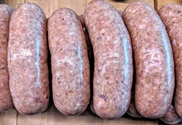 Homemade Italian sausage links ready for grilling
