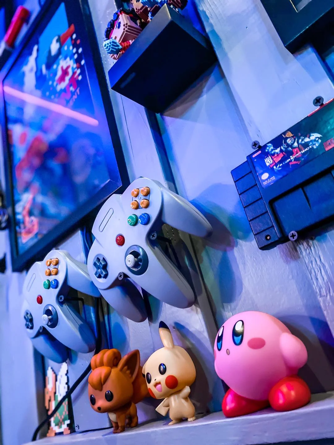 Colorful gaming display with controllers and figurines