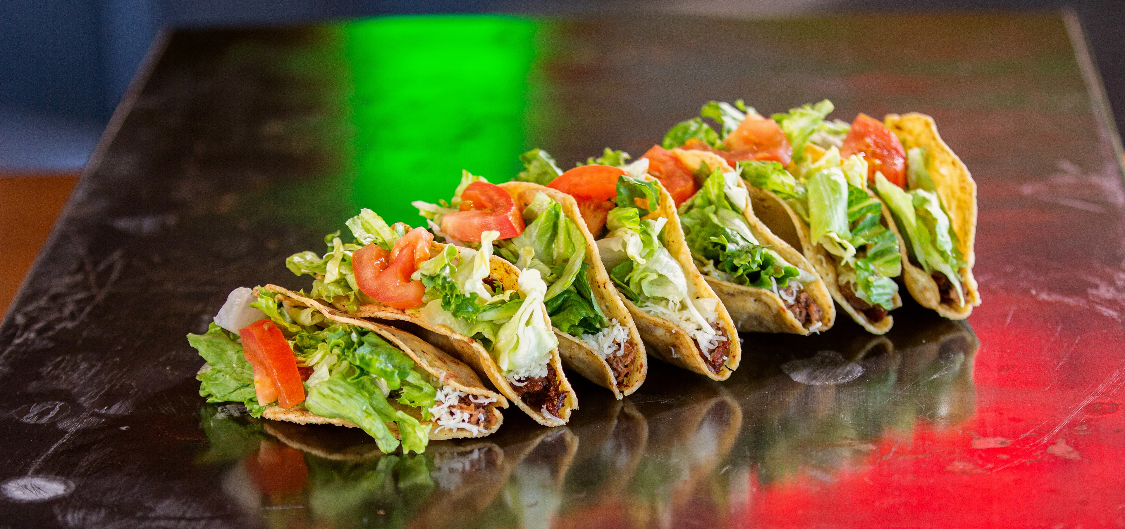 Delicious Mexican tacos with lettuce and tomato