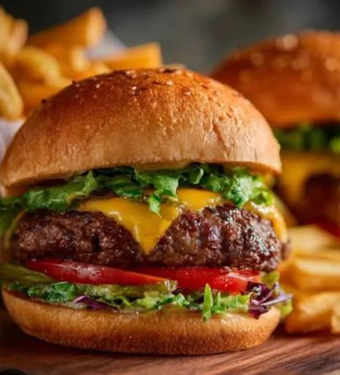 Juicy cheeseburger with fresh lettuce and tomato