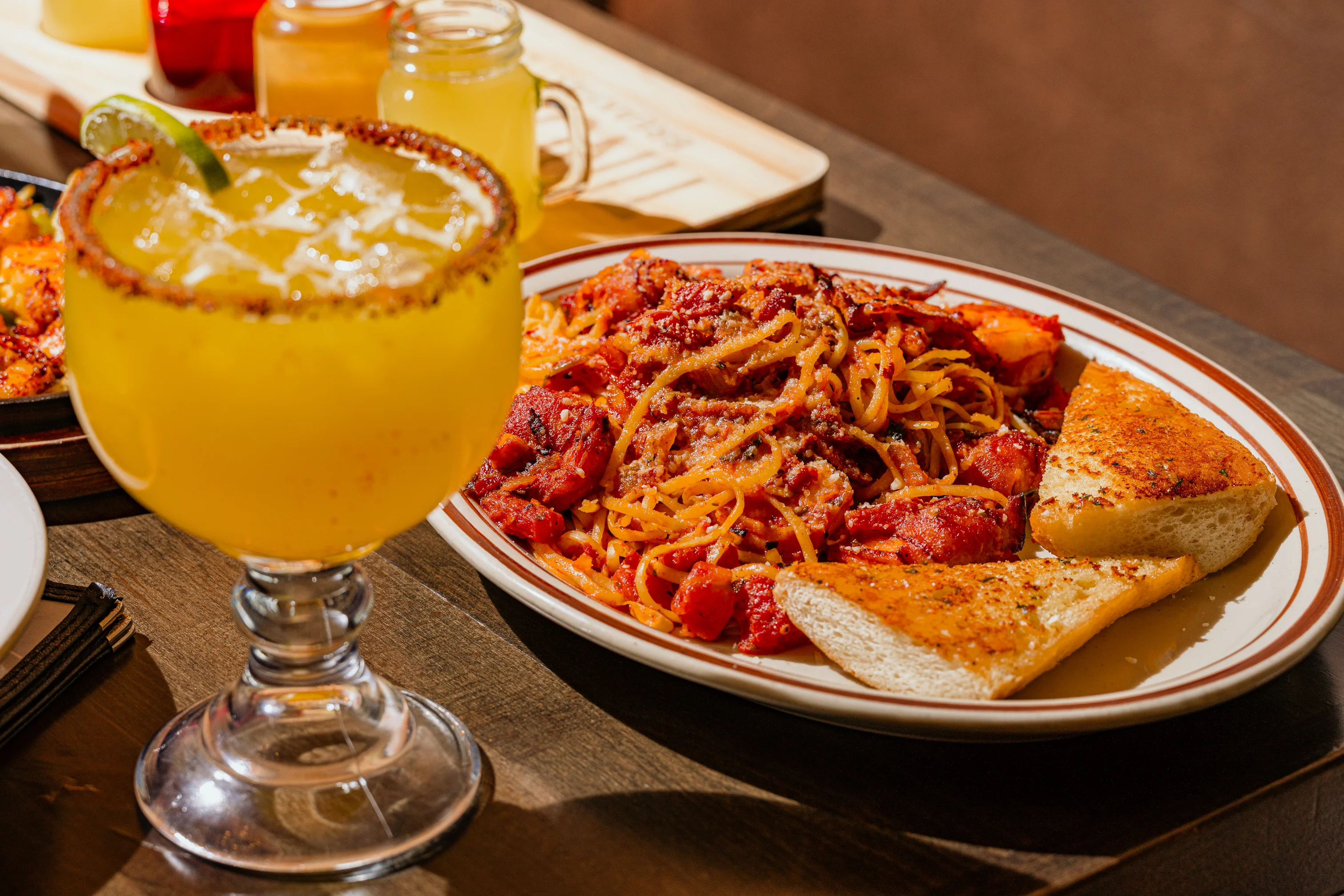 Plate of spaghetti with marinara sauce and garlic bread