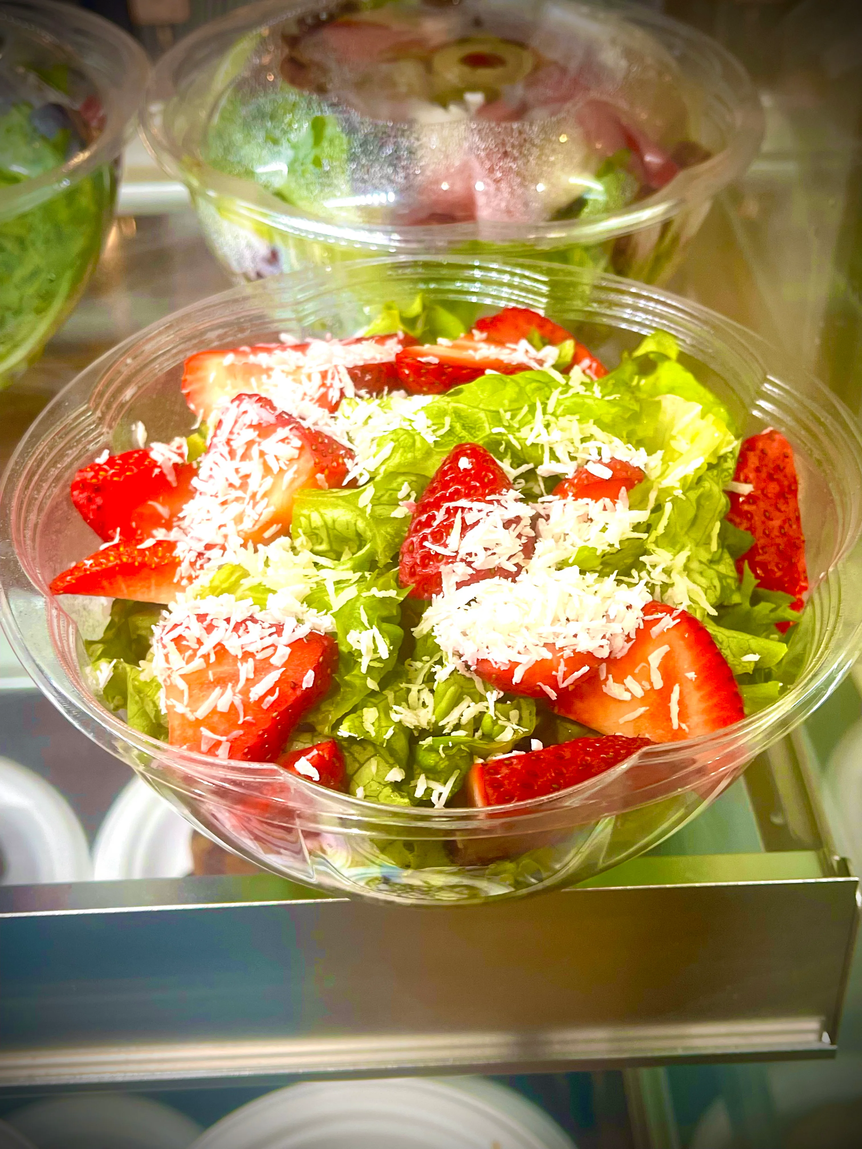 Fresh strawberry salad in a clear bowl