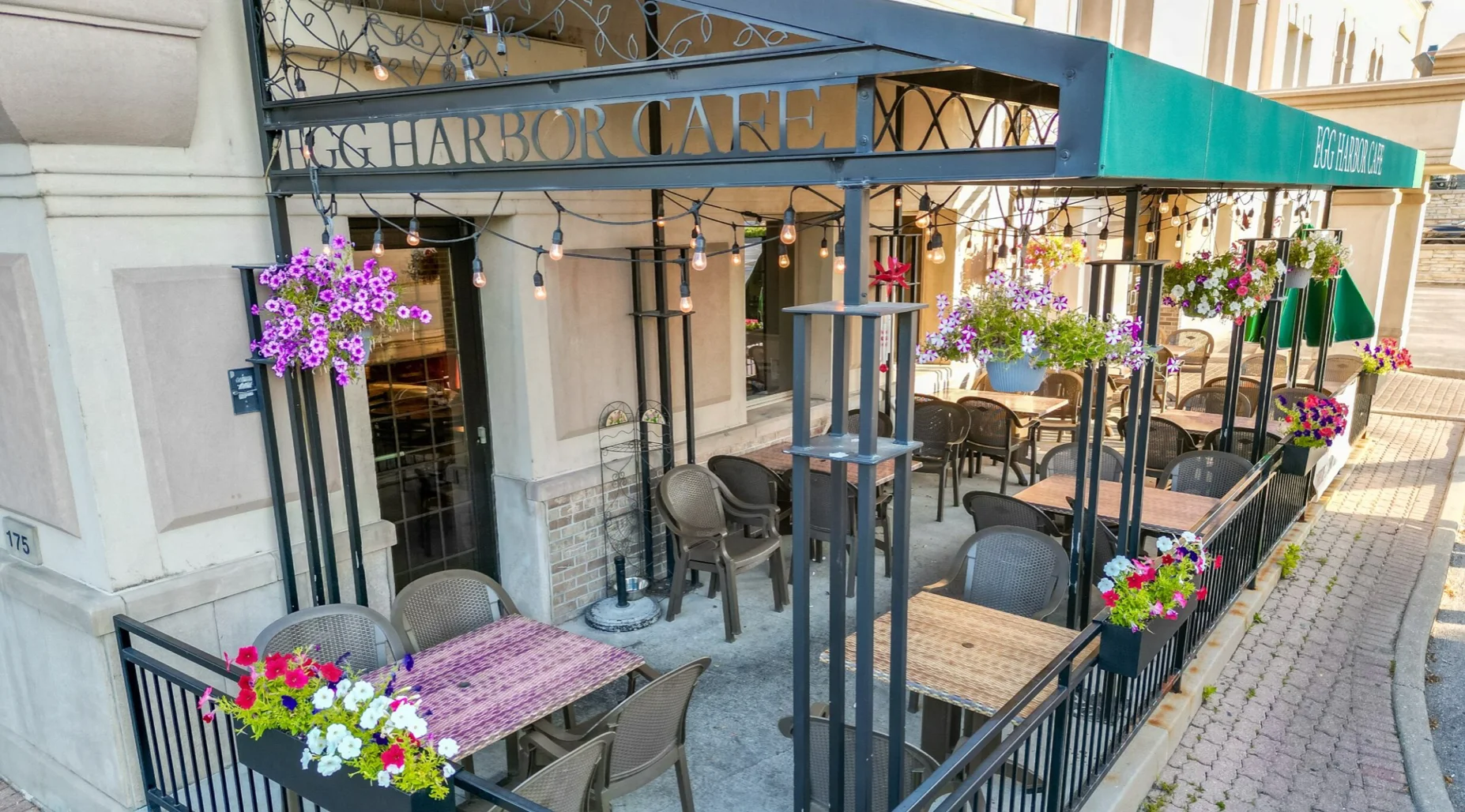 Charming outdoor dining area with flowers and cozy seating