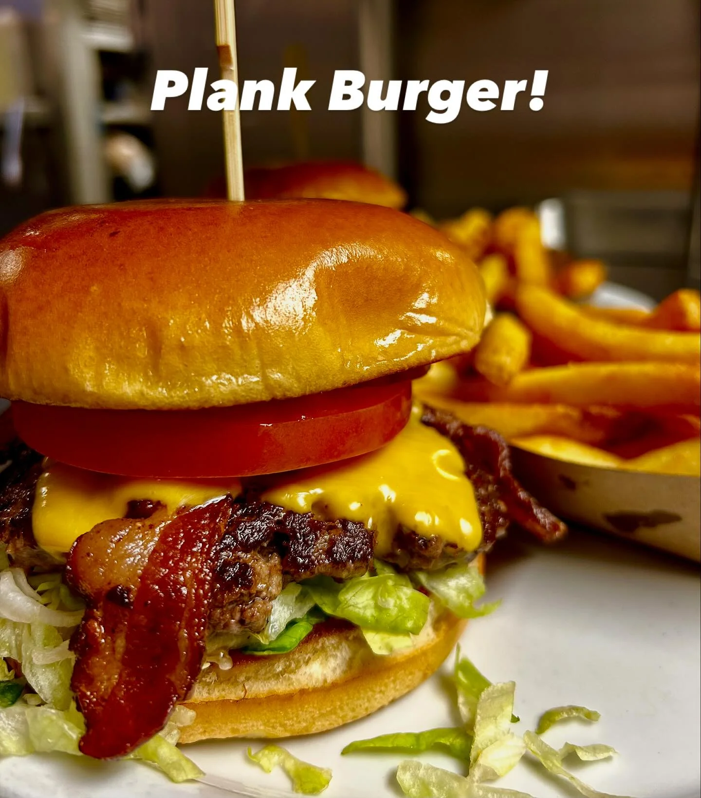 Juicy American cheeseburger with bacon and fries