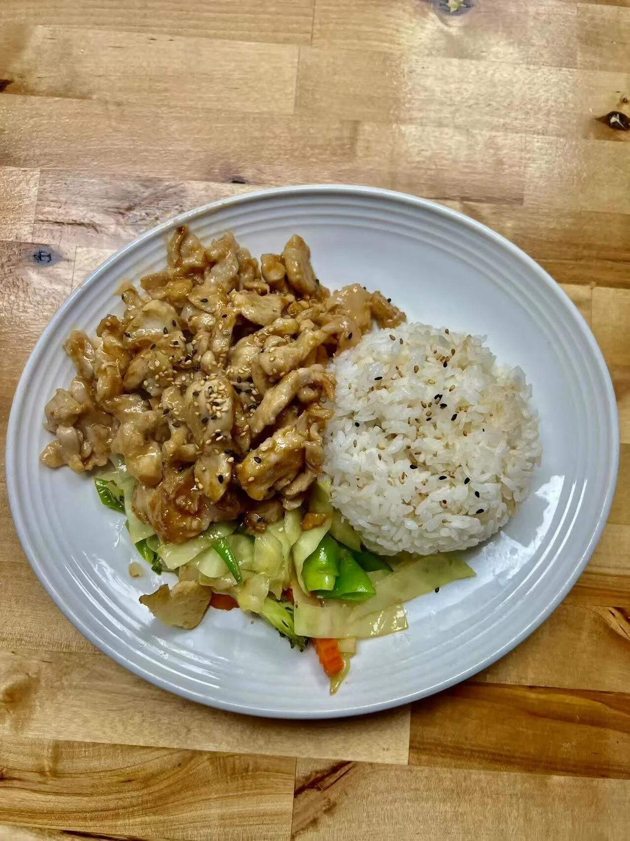 Korean chicken stir-fry served with rice and vegetables