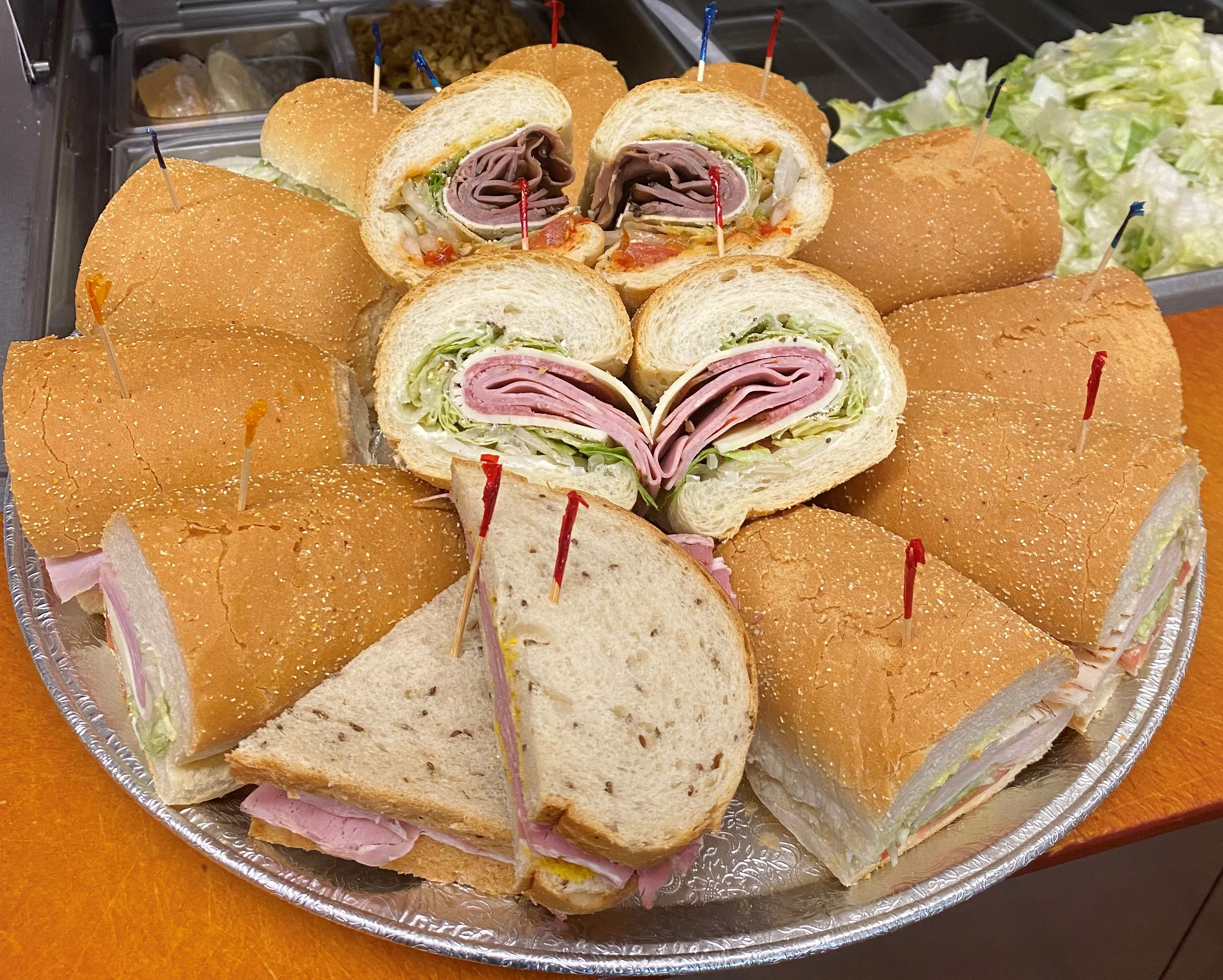 Assorted deli sandwiches on a platter