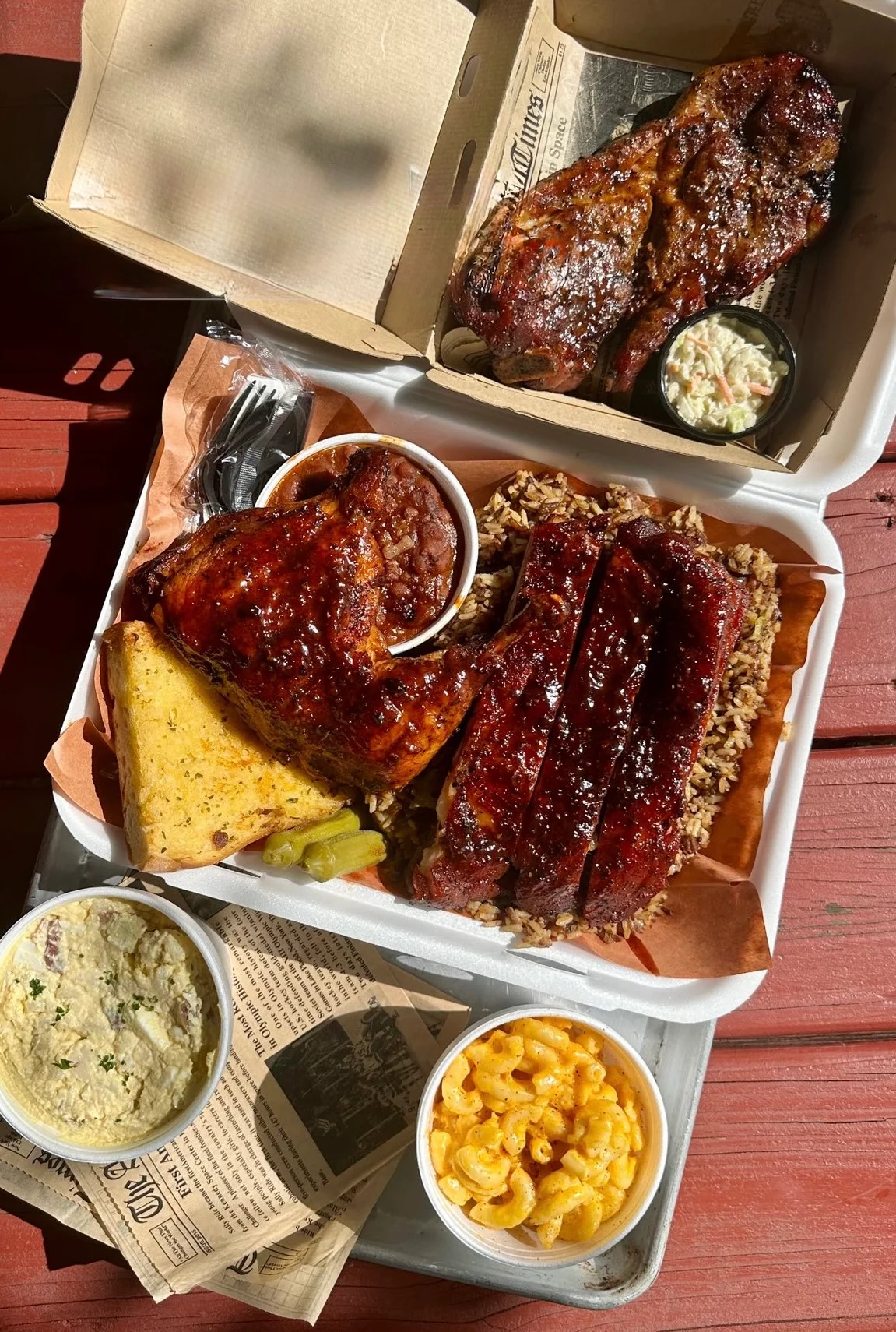 Barbecue Sunday: Rib and chicken BBQ plate with rice dressing, potato salad, baked beans with ground beef, coleslaw, and LeJeune's garlic bread