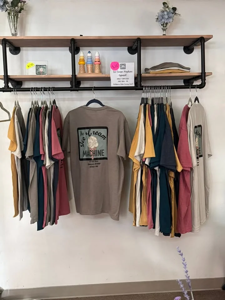 Display of colorful t-shirts at an ice cream shop