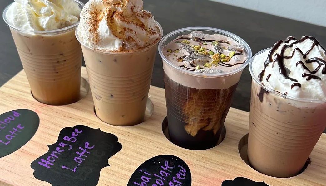 Variety of lattes including Honey Bee and Dubai Chocolate Cold Brew