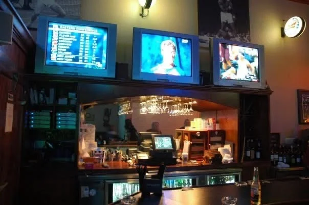 Group of friends enjoying a night out at a bar