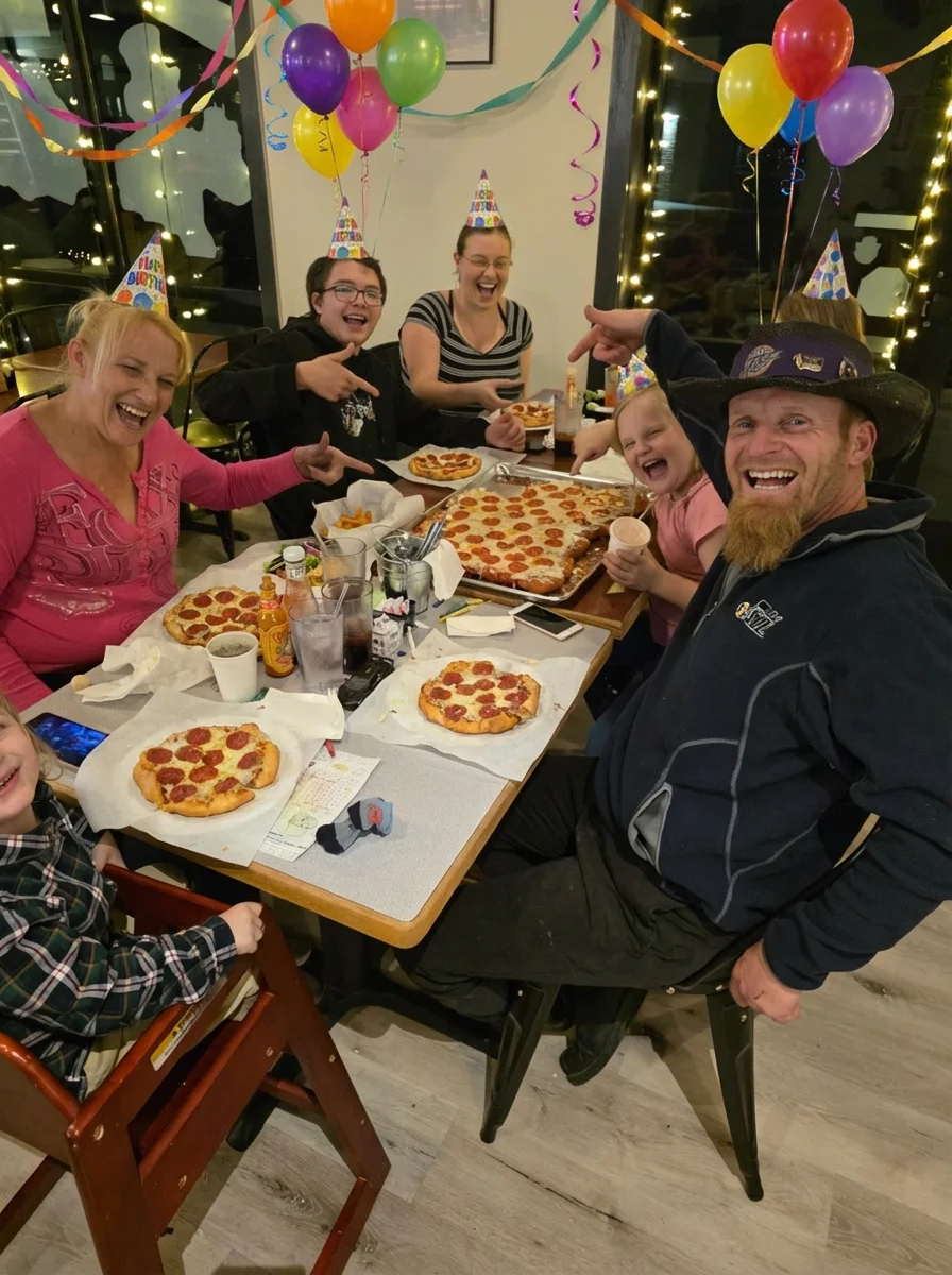 Family celebration with pepperoni pizzas at a festive restaurant