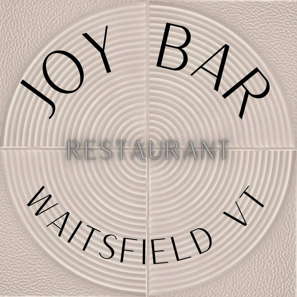 A decorative design featuring the name of a restaurant, 'Joy Bar', located in Waitsfield, Vermont. The design is circular with textured backgrounds.