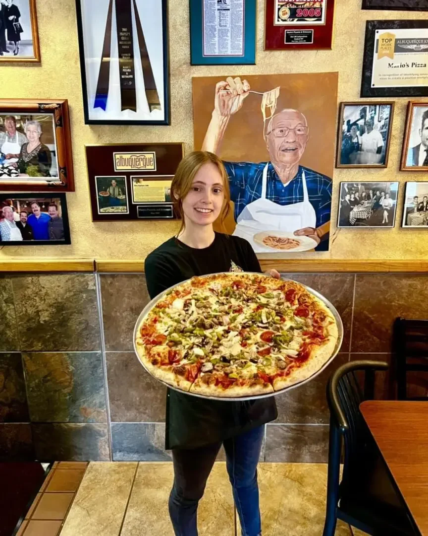 Large pepperoni pizza served in a cozy restaurant