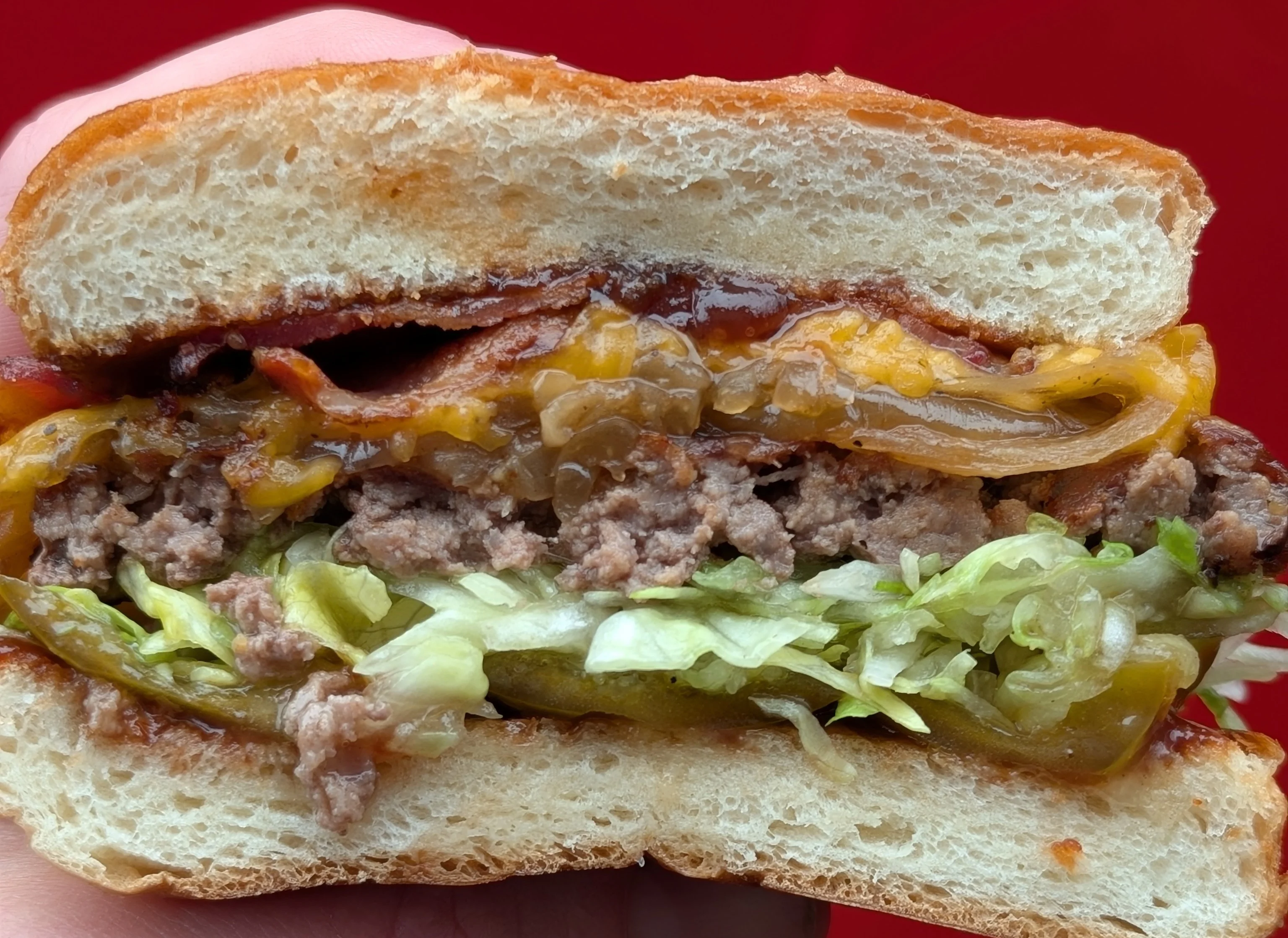 Juicy cheeseburger with bacon and fresh toppings