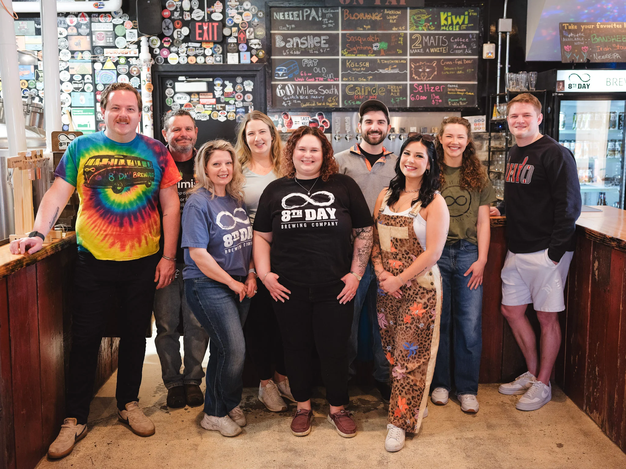 Staff posing at 8th Day Brewing Company bar