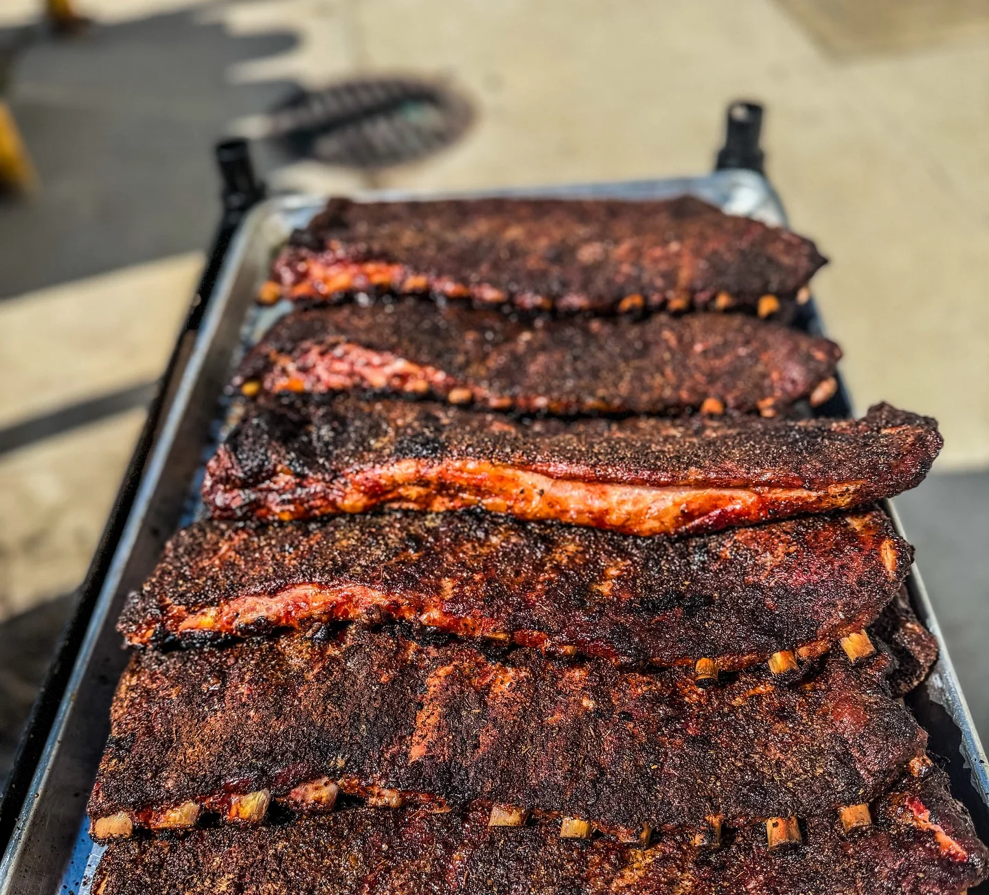 Smoked barbecue ribs with a rich, dark crust