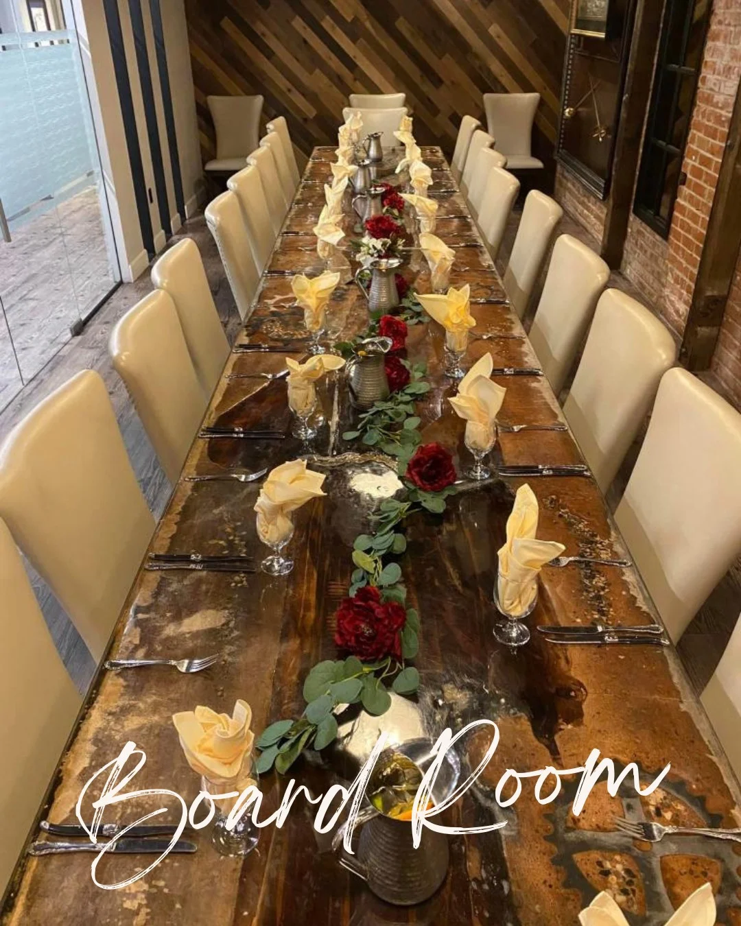 Elegant boardroom table set for a formal dining experience.