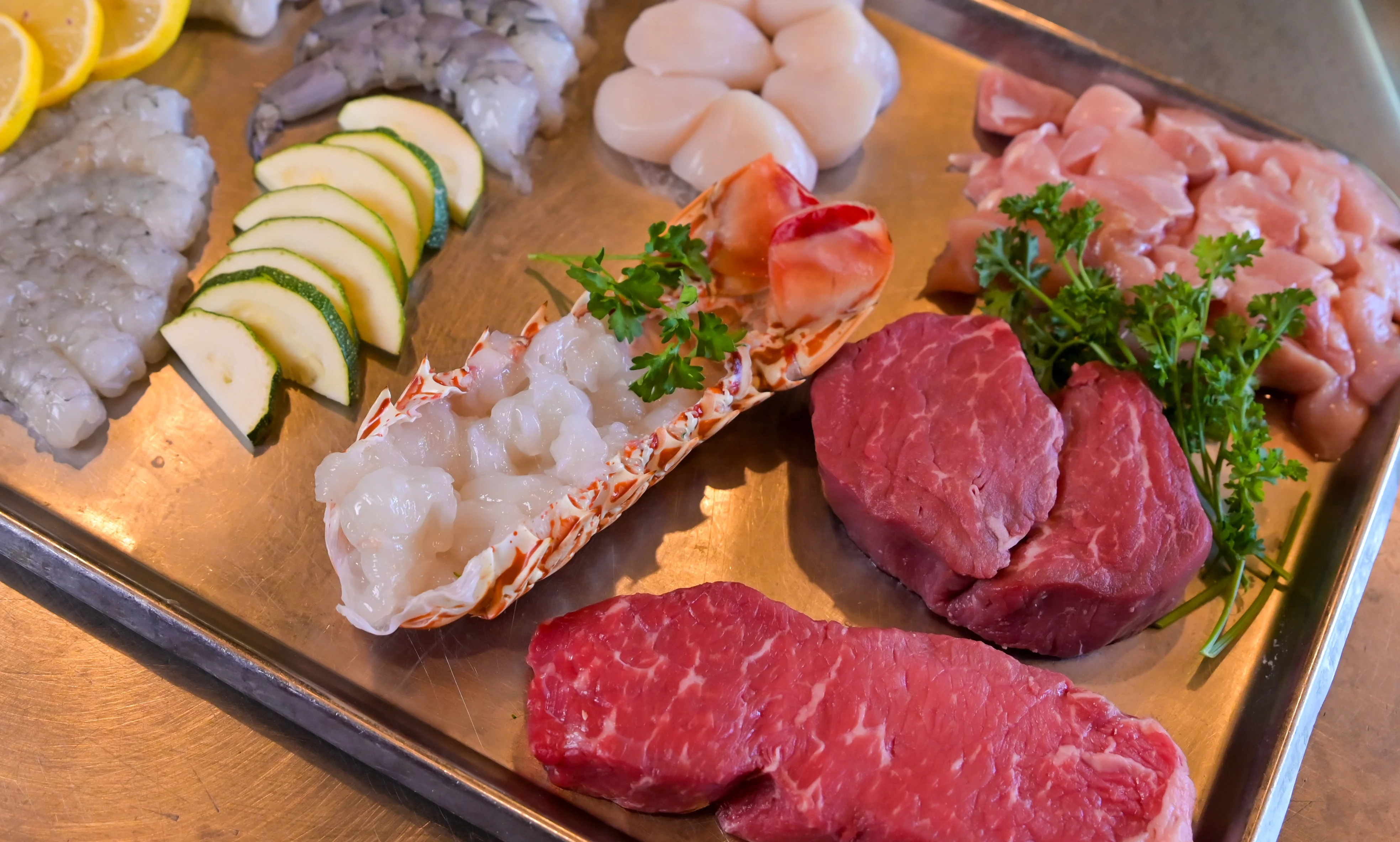 Assorted seafood and meats for Japanese shabu-shabu preparation
