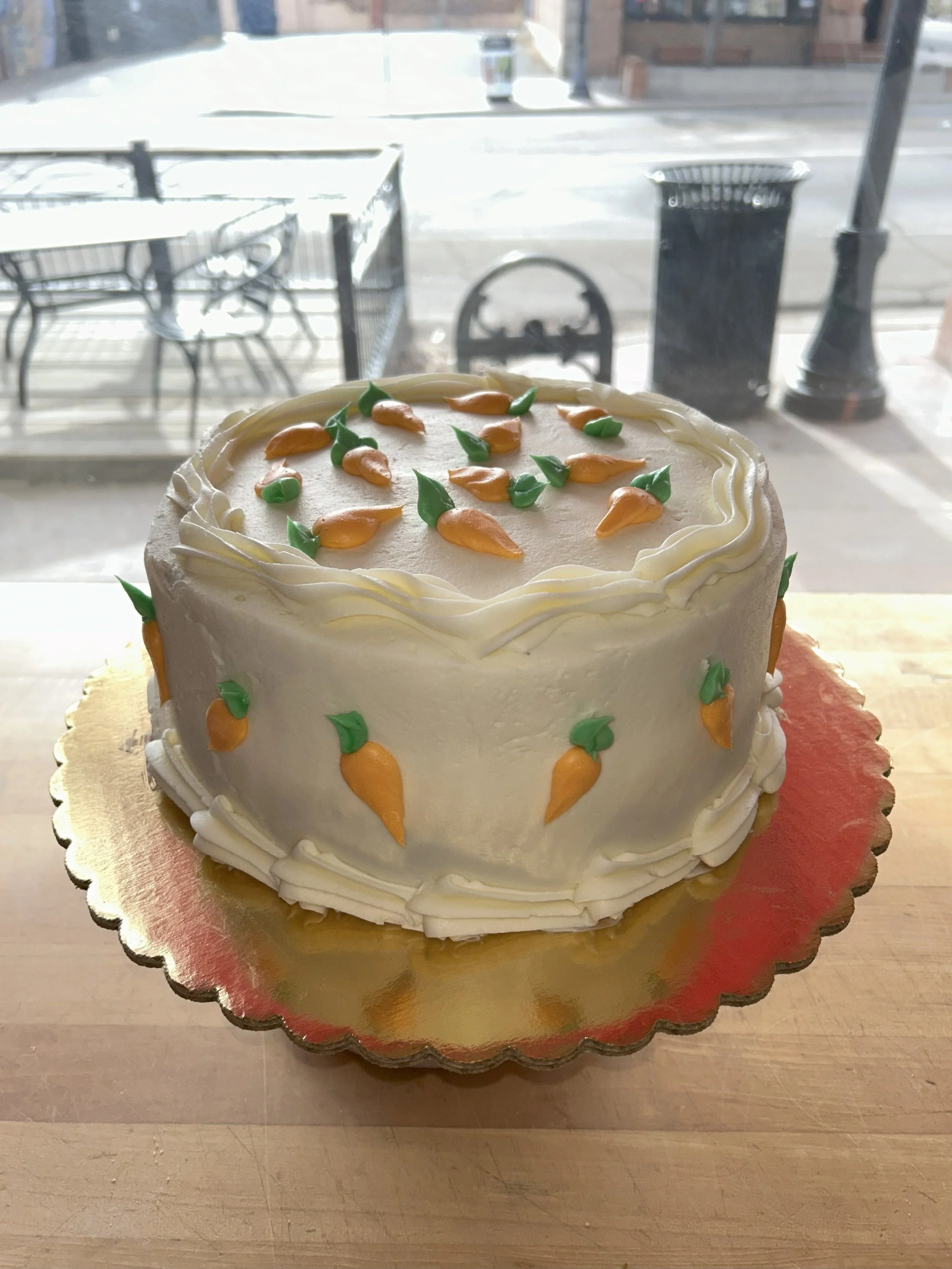 Decorative carrot cake with cream cheese frosting