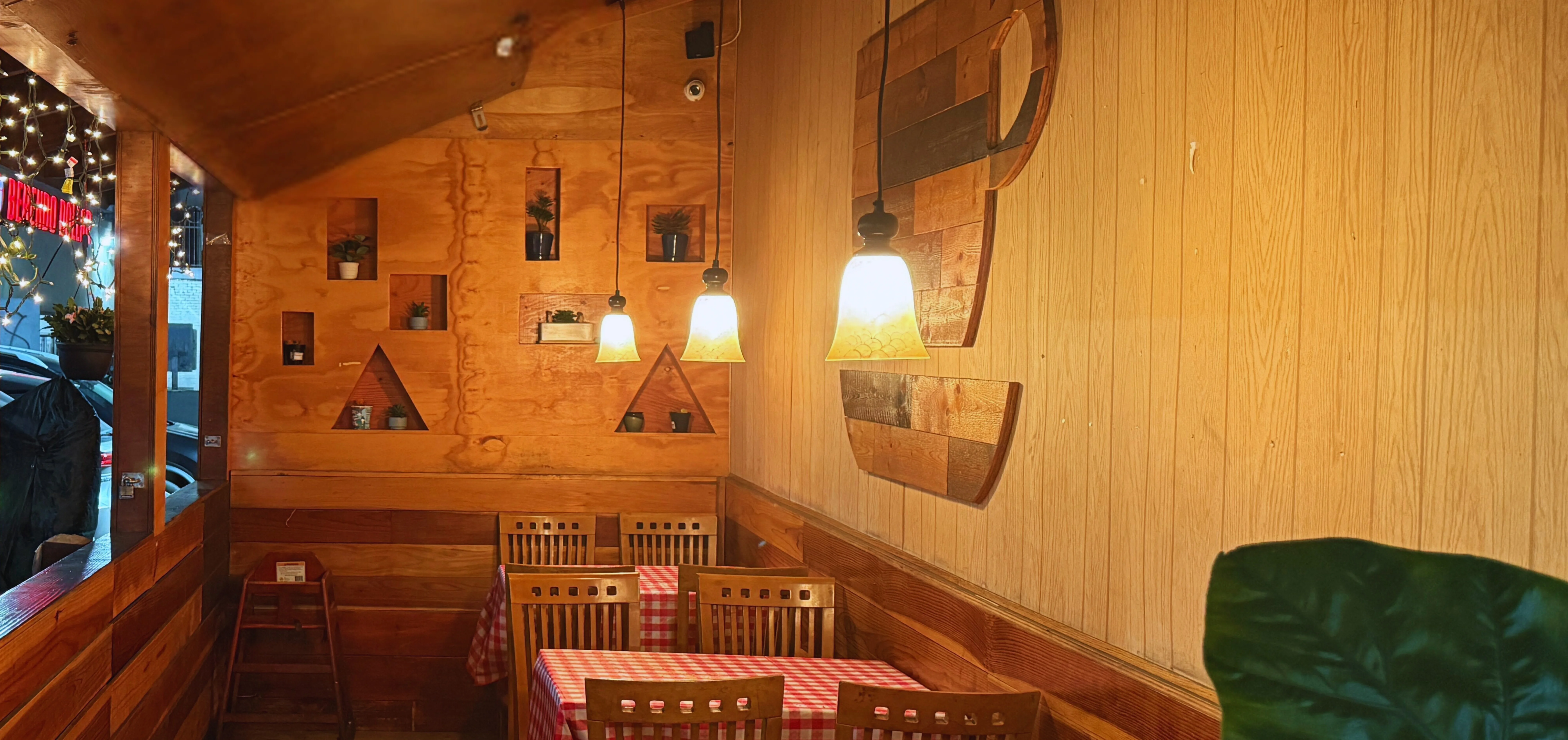 Cozy restaurant interior with wooden decor and warm lighting