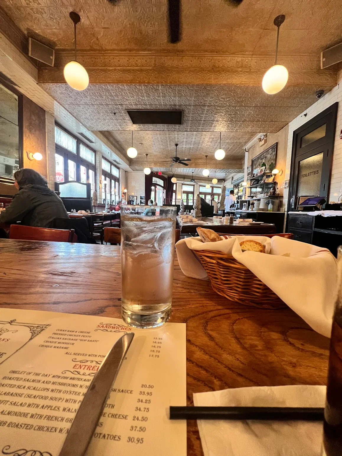 Cozy restaurant interior with wooden tables and warm lighting
