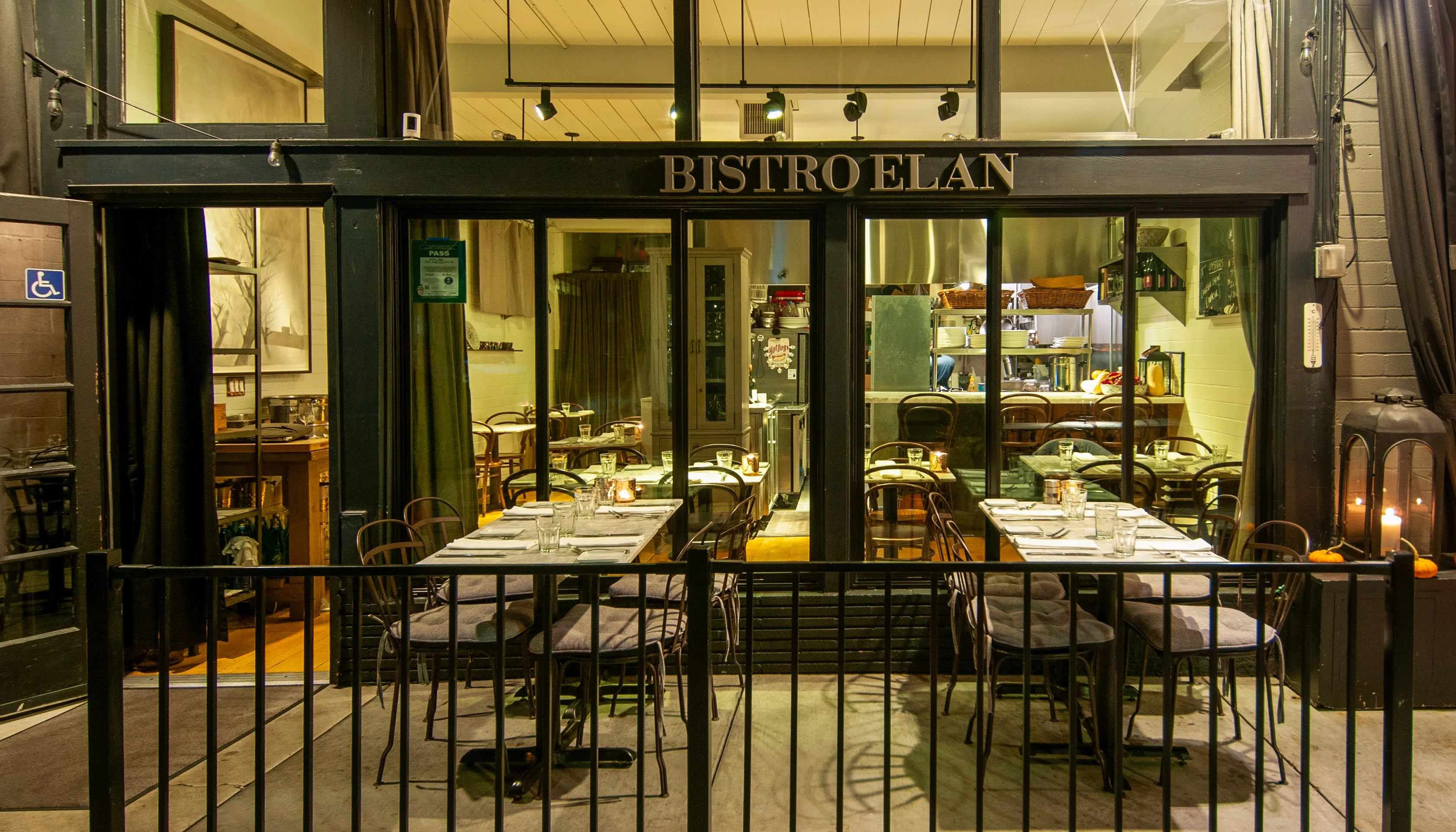 Charming bistro exterior with outdoor seating and warm lighting