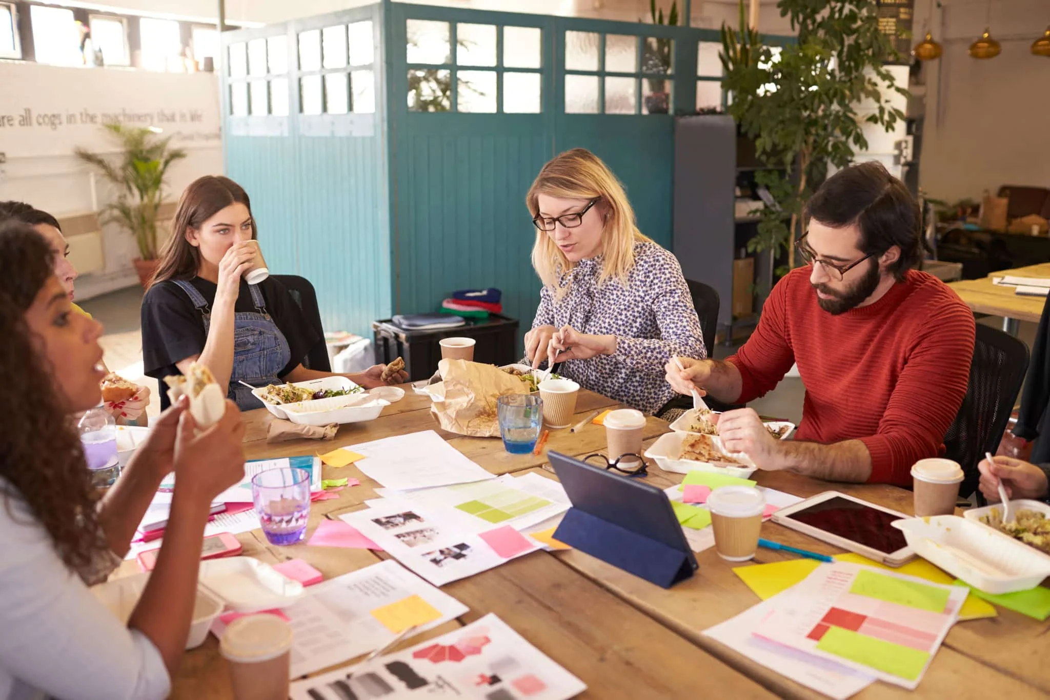 Group enjoying lunch during a collaborative meeting