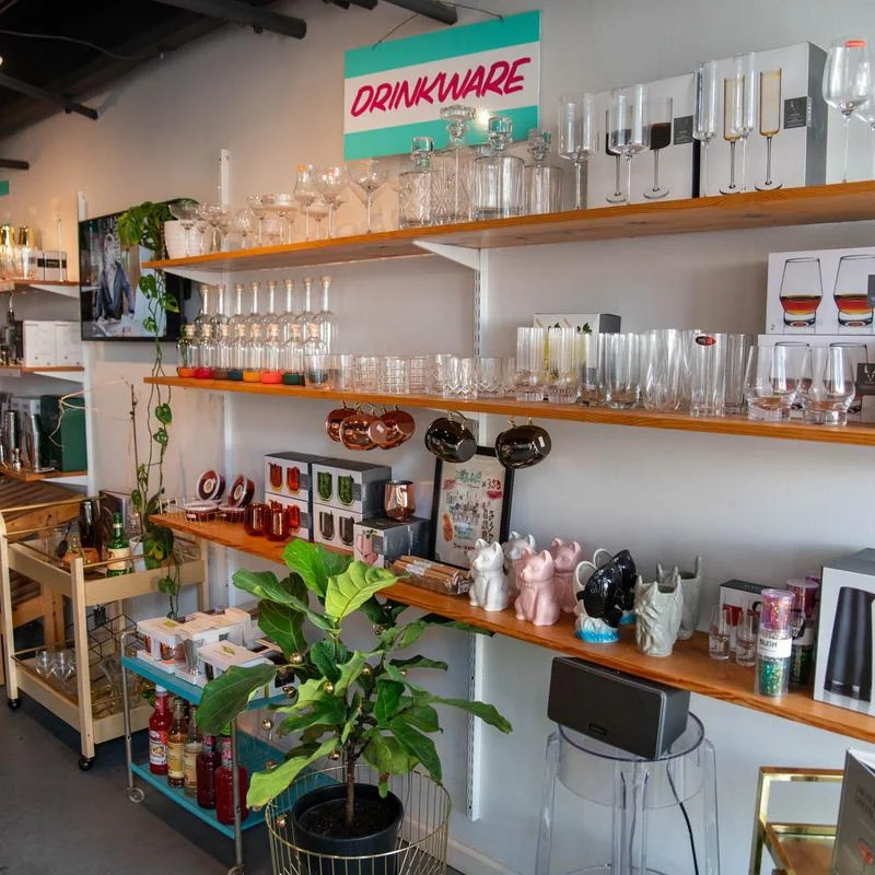 Display of various drinkware including glasses and bar accessories