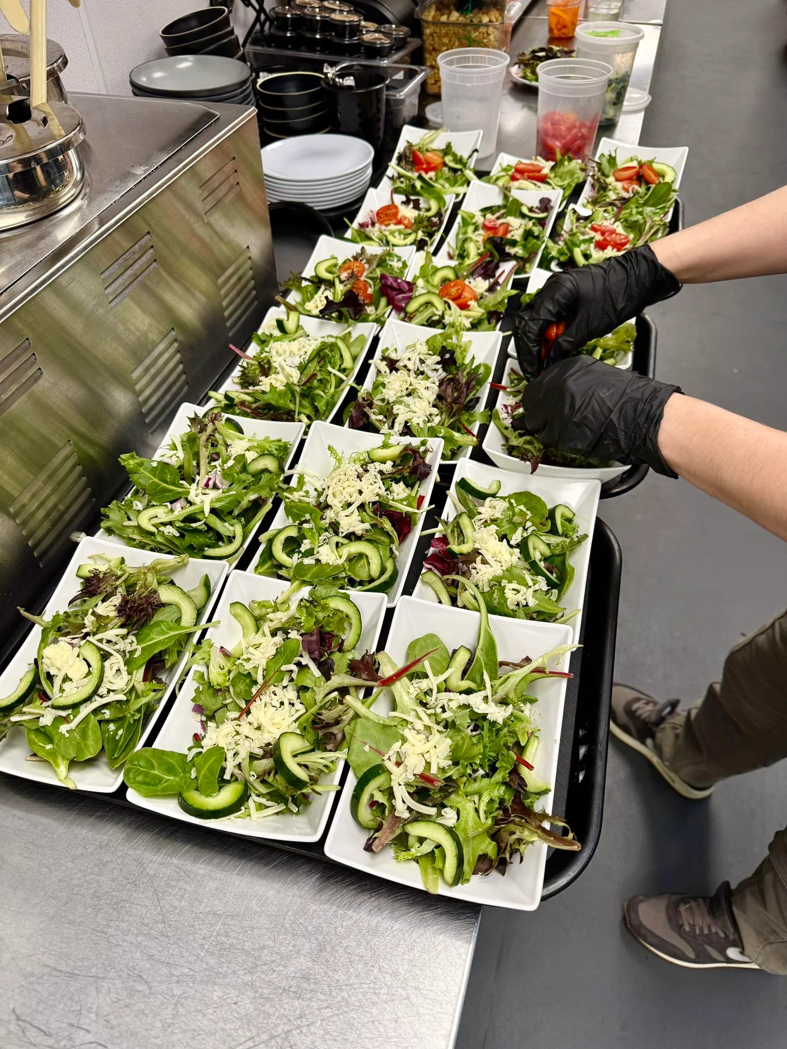 Fresh garden salad prepared for service in a restaurant kitchen