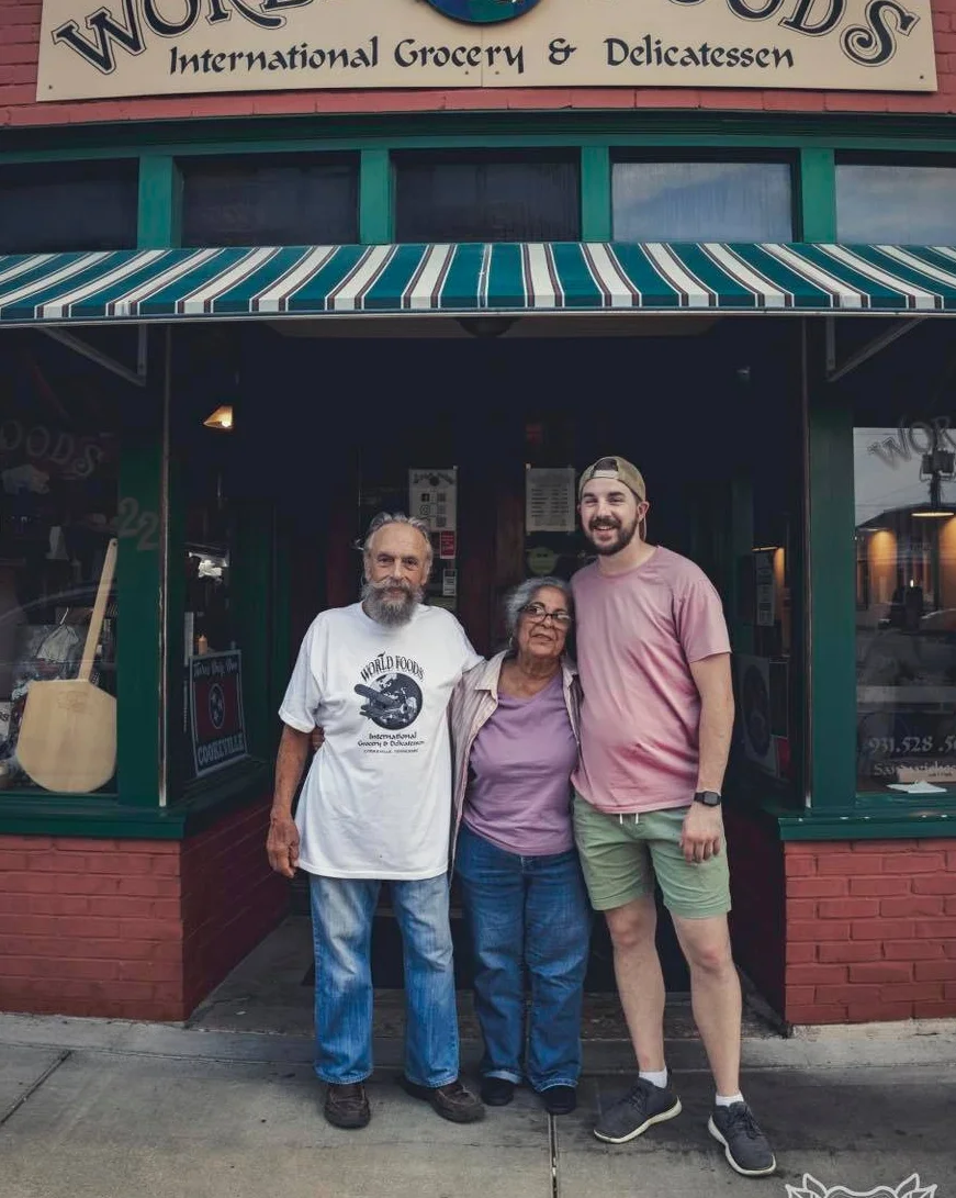 Exterior of World Foods grocery store with friendly staff