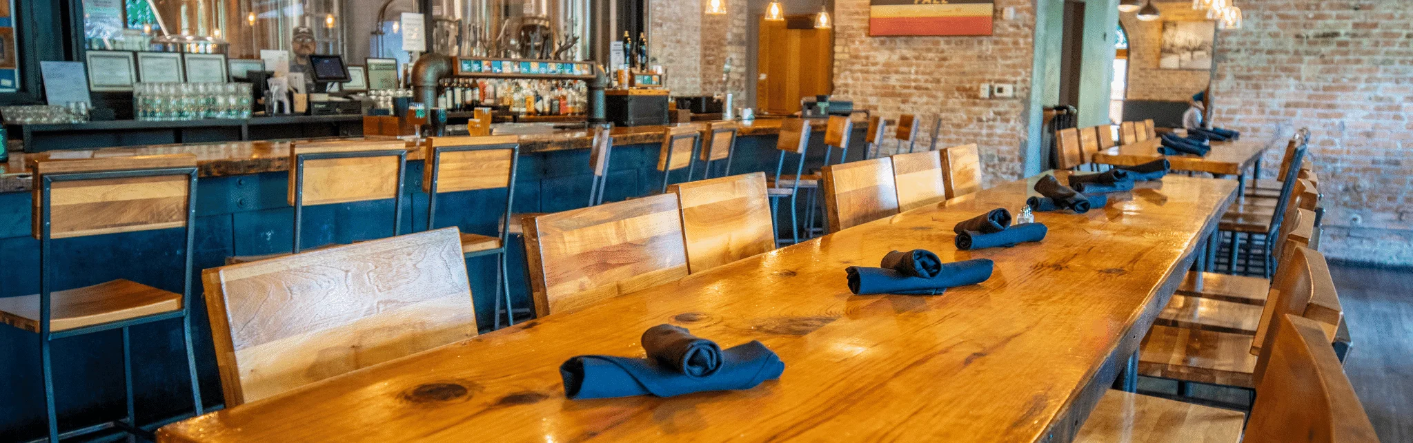 Cozy restaurant interior with wooden tables and bar seating