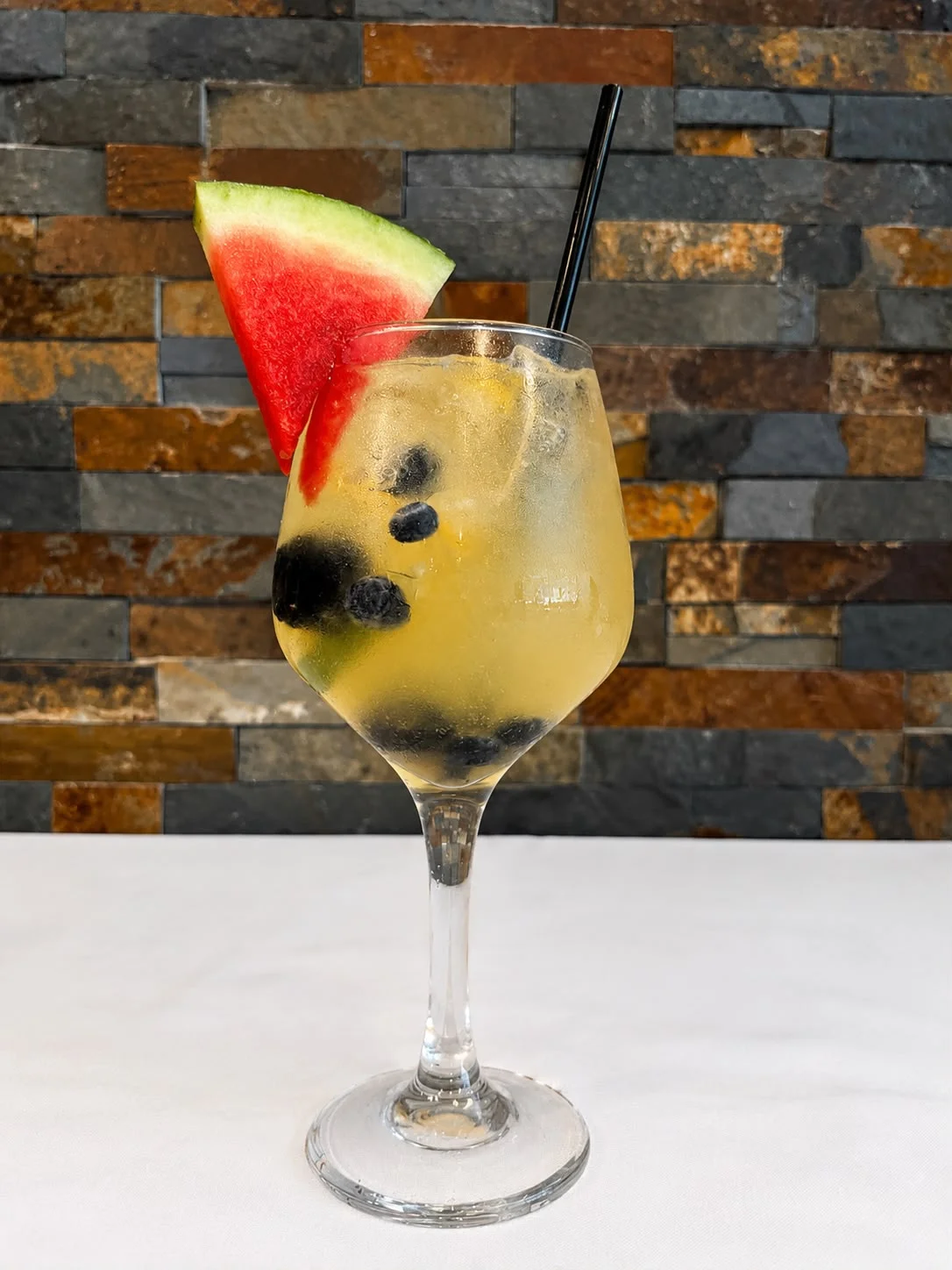 Refreshing summer cocktail with watermelon and blueberries