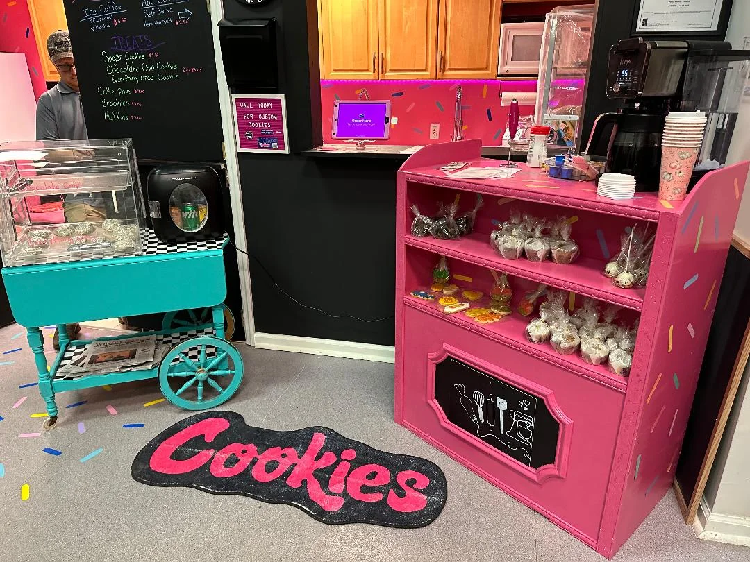 Colorful dessert display with cookies and treats in a vibrant cafe