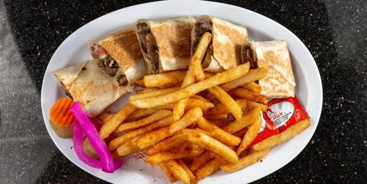 Delicious burritos served with crispy fries