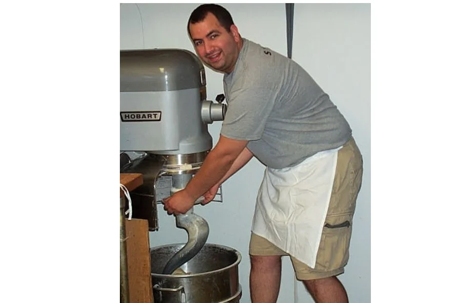 Chef using a Hobart mixer in a restaurant kitchen