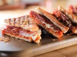 Crispy Mexican quesadilla with cheese and chorizo