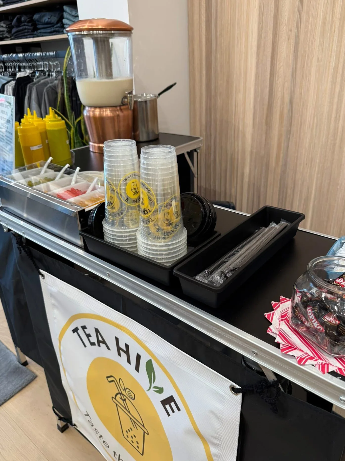 Beverage station with tea and cups at a modern cafe