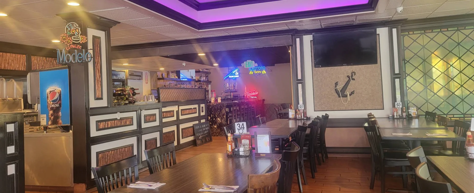 Cozy restaurant interior with modern decor and vibrant lighting