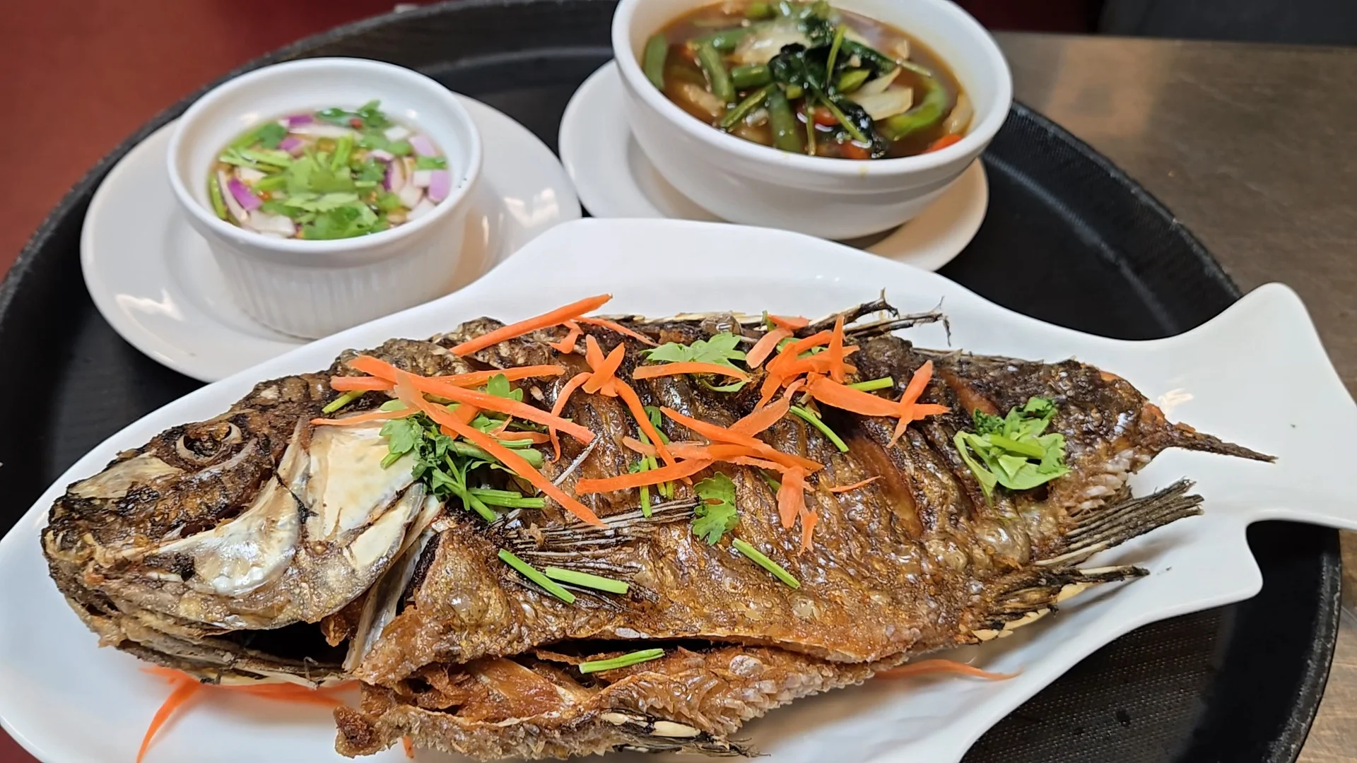 Crispy fried fish with dipping sauce and vegetable soup