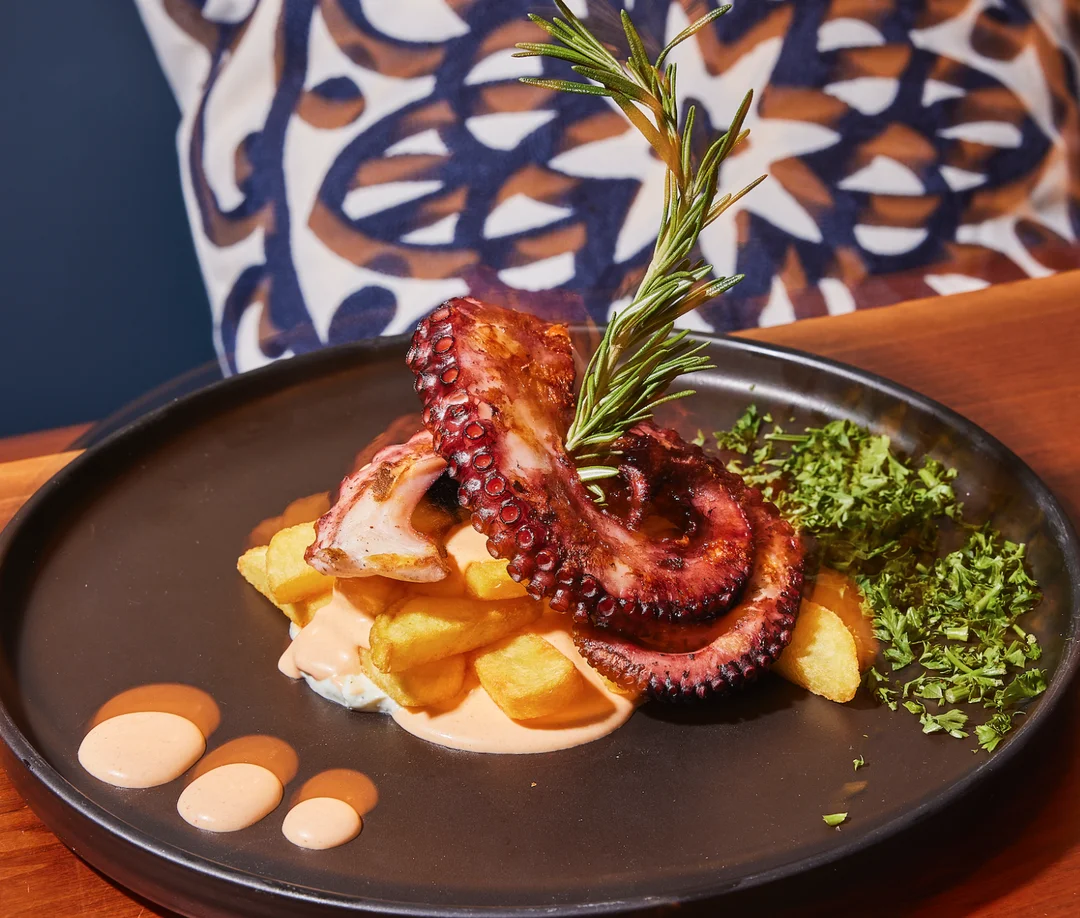 Mediterranean Octopus- Char-grilled octopus glazed with a tangy mediterranean herb sauce.