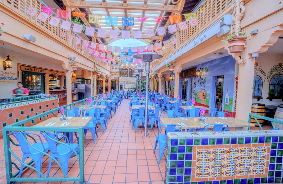 Vibrant restaurant interior with colorful decor and blue chairs